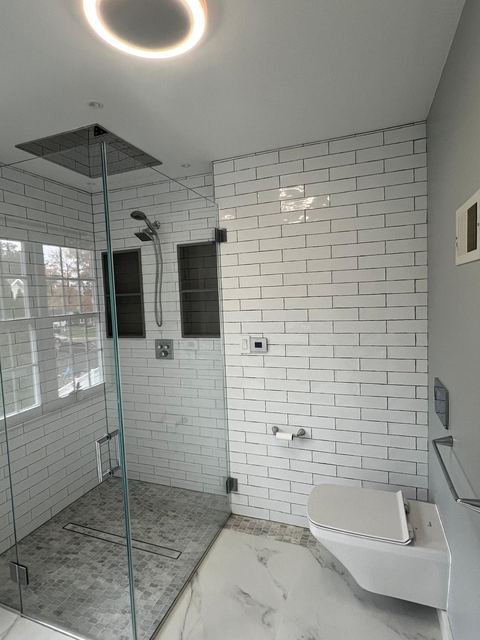 Subway tile & frameless glass shower